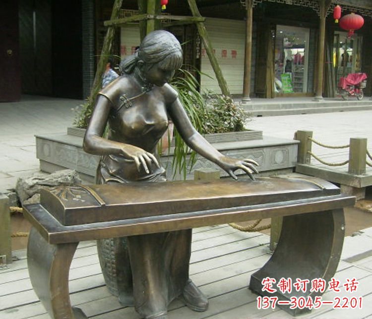 开封铜雕现代人物弹古筝雕塑